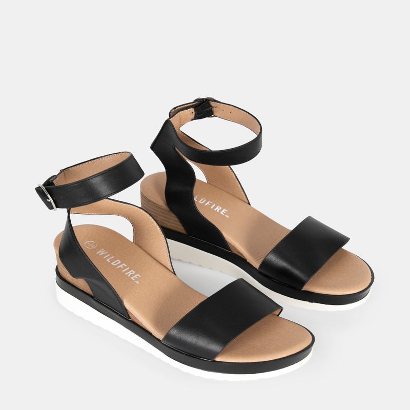 Tan women's leather sandals with slim straps and buckle closure, comfortable sandals ideal for warm weather and stylish summer sandals.